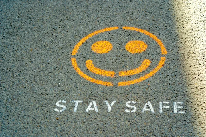 stay safe text with smiling emoji